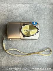 MaxSold Auction: Olympus Stylus 400 Digital Compact Camera - Silver - San Jose (California, USA) PARTNER MANAGED Estate Sale Online Auction -  E Humboldt