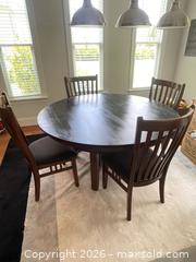 MaxSold Auction: 5-Piece Dark Brown Mission Style Oval Wood Dining Set - Fuquay-Varina (North Carolina, USA) PARTNER MANAGED Downsizing Online Auction - Dairy Glen Drive