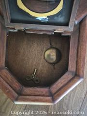 MaxSold Auction: Antique Vintage Wooden Wall Clock with Pendulum & Roman Numerals - Fuquay-Varina (North Carolina, USA) PARTNER MANAGED Downsizing Online Auction - Dairy Glen Drive