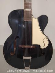 MaxSold Auction: Silvertone Archtop Hollow-Body Acoustic Guitar, Black - Toronto (Ontario, Canada) PARTNER MANAGED Reseller Online Auction - Queen Street Wt.