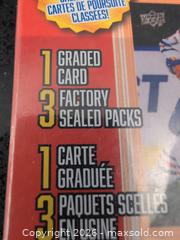 MaxSold Auction: Hockey Trading Card Lot: 1 Graded Card + 3 Factory Sealed Packs - Welland (Ontario, Canada) SELLER MANAGED Reseller Online Auction - Young Road