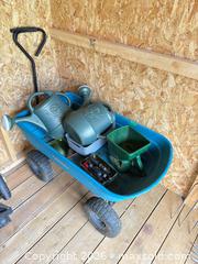 MaxSold Auction: Garden cart with turf builder, watering cans and hose attachments  - Gananoque (Ontario, Canada) SELLER MANAGED Downsizing Online Auction -Elmwood Drive