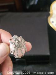 MaxSold Auction: Dallas Prince Signed 925 Thailand Octopus Ring with Rose Pink Cabochon, Size 7 - Richmond (British Columbia, Canada) SELLER MANAGED Downsizing Online Auction - Riverside Way (STORAGE)