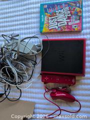 MaxSold Auction: Nintendo Wii Mini Red/Black Console with Just Dance 2016 - Welland (Ontario, Canada) SELLER MANAGED Reseller Online Auction -  Young Road