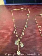 MaxSold Auction: Lot of Two Mixed-Metal Matinee Charm Necklaces Swarovski  - Toronto (Ontario, Canada) SELLER MANAGED Downsizing Online Auction -  Weston Road (CONDO)