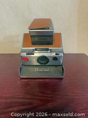 MaxSold Auction: Polaroid SX-70 Instant Film Camera, Brown Leather & Chrome Vintage  - Toronto (Ontario, Canada) SELLER MANAGED Downsizing Online Auction -  Weston Road (CONDO)