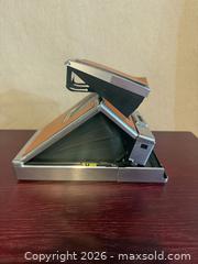 MaxSold Auction: Polaroid SX-70 Instant Film Camera, Brown Leather & Chrome Vintage  - Toronto (Ontario, Canada) SELLER MANAGED Downsizing Online Auction -  Weston Road (CONDO)