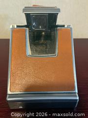 MaxSold Auction: Polaroid SX-70 Instant Film Camera, Brown Leather & Chrome Vintage  - Toronto (Ontario, Canada) SELLER MANAGED Downsizing Online Auction -  Weston Road (CONDO)