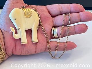 MaxSold Auction: (10K) Gold Paperclip Chain with White Carved Elephant Pendant - New Westminster (British Columbia, Canada) PARTNER MANAGED Downsizing Online Auction - Quayside Drive (CONDO)