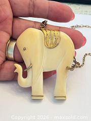 MaxSold Auction: (10K) Gold Paperclip Chain with White Carved Elephant Pendant - New Westminster (British Columbia, Canada) PARTNER MANAGED Downsizing Online Auction - Quayside Drive (CONDO)