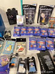 MaxSold Auction: Lot of 11–30 Disney & Tomy Collectible Pins, Figurines, Display B - Doylestown Township (Pennsylvania, USA) PARTNER MANAGED Downsizing Online Auction - Country Brook Drive