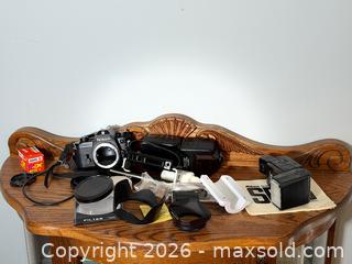 MaxSold Auction: Nikon EM 35mm SLR Film Camera Body + other Camera Accessories - Fort Erie (Ontario, Canada) SELLER MANAGED Estate Sale Online Auction - Caribou Trail Ridgway