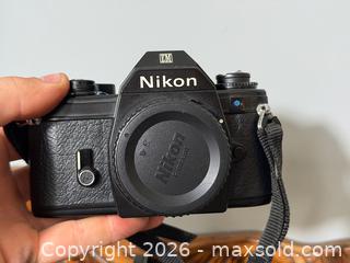 MaxSold Auction: Nikon EM 35mm SLR Film Camera Body + other Camera Accessories - Fort Erie (Ontario, Canada) SELLER MANAGED Estate Sale Online Auction - Caribou Trail Ridgway