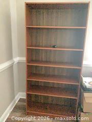 MaxSold Auction: Brown Laminated Particleboard/MDF Bookshelf, 6 Fixed Shelves - Jacksonville (Florida, USA) SELLER MANAGED Downsizing Online Auction - Spanish Marsh Court