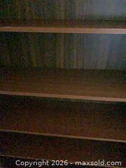 MaxSold Auction: Brown Laminated Particleboard/MDF Bookshelf, 6 Fixed Shelves - Jacksonville (Florida, USA) SELLER MANAGED Downsizing Online Auction - Spanish Marsh Court
