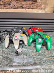 MaxSold Auction: Nintendo 64 (N64) Console with 4+ Controllers & 30+ Games - West Vancouver (British Columbia, Canada) SELLER MANAGED Moving Online Auction - Dogwood Lane