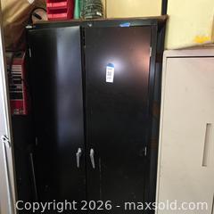 MaxSold Auction: Black Metal Two-Door Storage Cabinet, Tall - Stevensville (Maryland, USA) PARTNER MANAGED Downsizing Online Auction - Old Love Point Road