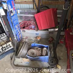 MaxSold Auction: Cast Iron Weight Plates & Aluminum Diamond Truck Toolbox, Cords & Tote - Stevensville (Maryland, USA) PARTNER MANAGED Downsizing Online Auction - Old Love Point Road