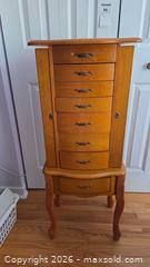 MaxSold Auction: Honey Light Oak Jewelry Armoire with Side Hooks & Lockable Doors - Pembroke (Ontario, Canada) PARTNER MANAGED Downsizing Online Auction - Ellis Avenue