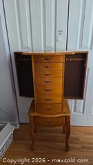 MaxSold Auction: Honey Light Oak Jewelry Armoire with Side Hooks & Lockable Doors - Pembroke (Ontario, Canada) PARTNER MANAGED Downsizing Online Auction - Ellis Avenue