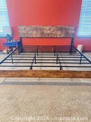 MaxSold Auction: Black and wooden King size bed frame with a new king size mattress included.  - Johnstown (Colorado, USA) SELLER MANAGED Downsizing Online Auction -  Sloan Drive