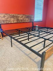 MaxSold Auction: Black and wooden King size bed frame with a new king size mattress included.  - Johnstown (Colorado, USA) SELLER MANAGED Downsizing Online Auction -  Sloan Drive