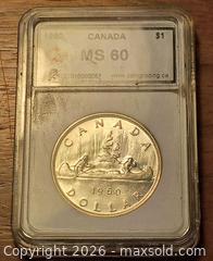 MaxSold Auction: 1960 Canada Silver $1 Voyageur Canoe Coin Graded Slab. - South Frontenac (Ontario, Canada) SELLER MANAGED Moving Online Auction - Battersea Road Battersea Road