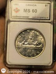 MaxSold Auction: 1960 Canada Silver $1 Voyageur Canoe Coin Graded Slab. - South Frontenac (Ontario, Canada) SELLER MANAGED Moving Online Auction - Battersea Road Battersea Road