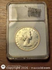 MaxSold Auction: 1960 Canada Silver $1 Voyageur Canoe Coin Graded Slab. - South Frontenac (Ontario, Canada) SELLER MANAGED Moving Online Auction - Battersea Road Battersea Road