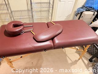 MaxSold Auction: Portable Burgundy Vinyl Massage Table with Wood Frame - Longmont (Colorado, USA) SELLER MANAGED Downsizing Online Auction - Trail Ridge Road