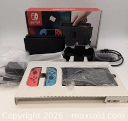 MaxSold Auction: Nintendo Switch (standard) Console with Dock & Neon Joy?Con - Toronto (Ontario, Canada) SELLER MANAGED Commercial Liquidation Online Auction - Ingram Drive