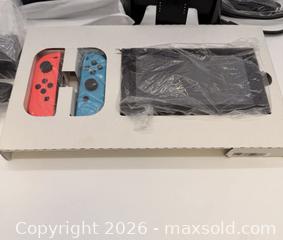 MaxSold Auction: Nintendo Switch (standard) Console with Dock & Neon Joy?Con - Toronto (Ontario, Canada) SELLER MANAGED Commercial Liquidation Online Auction - Ingram Drive