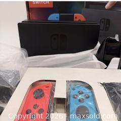 MaxSold Auction: Nintendo Switch (standard) Console with Dock & Neon Joy?Con - Toronto (Ontario, Canada) SELLER MANAGED Commercial Liquidation Online Auction - Ingram Drive