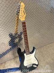 MaxSold Auction: Peavey Electric Guitar Black  - Vancouver (British Columbia, Canada) PARTNER MANAGED Estate Sale Online Auction -  East 7th Avenue (STORAGE)