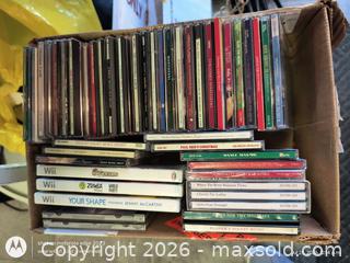MaxSold Auction: Lot of 26-50 Audio CDs and Wii Game Discs (Cases Included) - Kingston (Ontario, Canada) SELLER MANAGED Downsizing Online Auction -  Railway Street