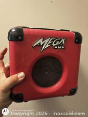 MaxSold Auction: Mega Amp VL-10 Practice/Portable Mini Guitar Amp - Red - Kingston (Ontario, Canada) SELLER MANAGED Downsizing Online Auction -  Railway Street