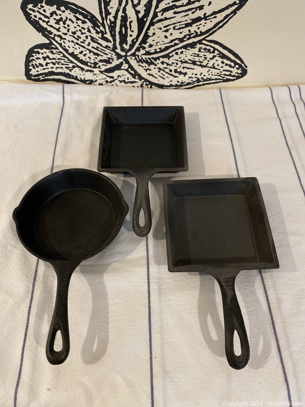 https://d12srav5gxm0re.cloudfront.net/auctionimages/79979/1704220229/wset_of_three_cast-iron_baking_skillets-29-1.jpeg