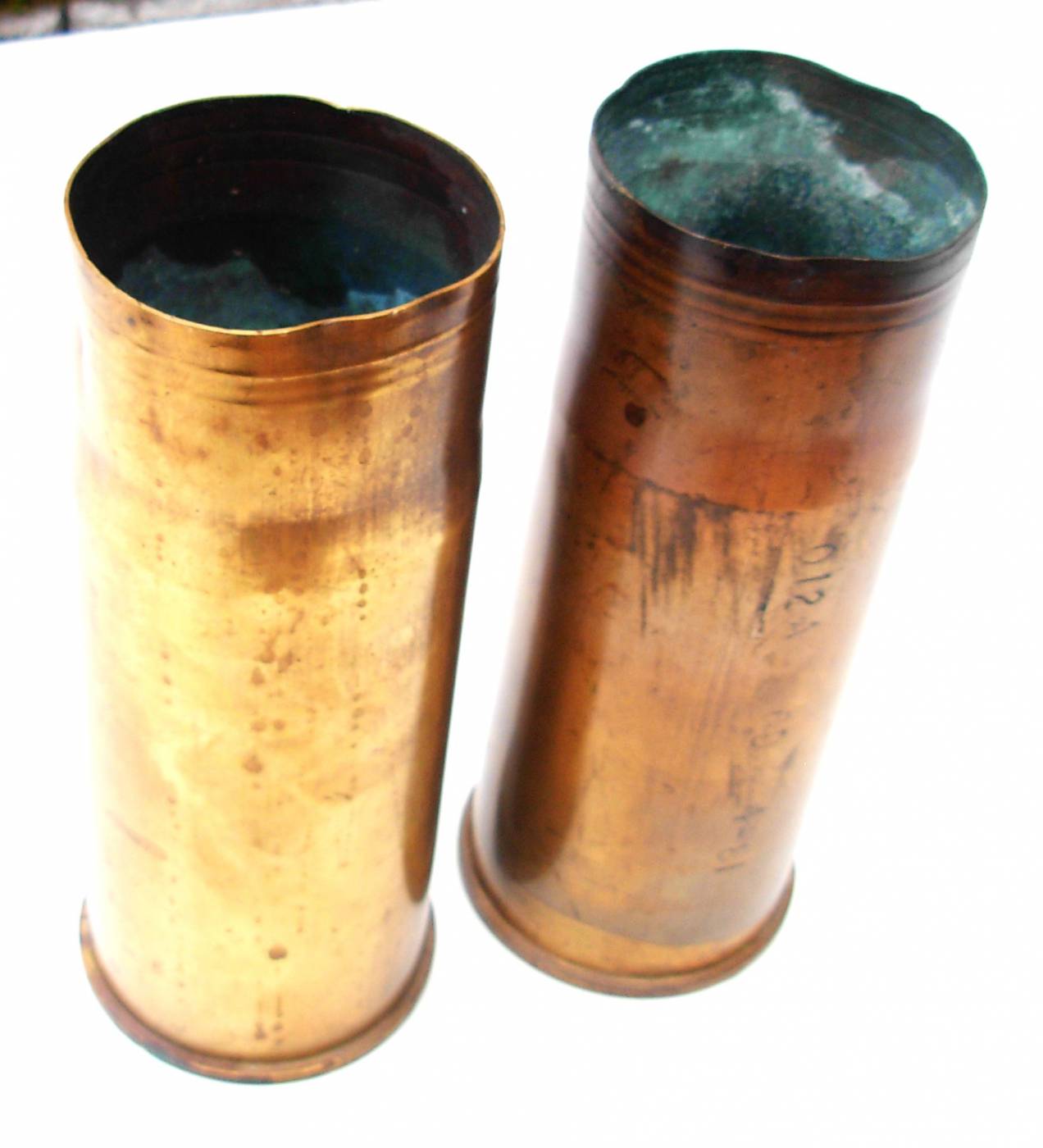 A COLLECTION OF BRASS SHELL CASINGS. A 76mm ARMD shell casing dated 1957,  three 40mm casings dated 1