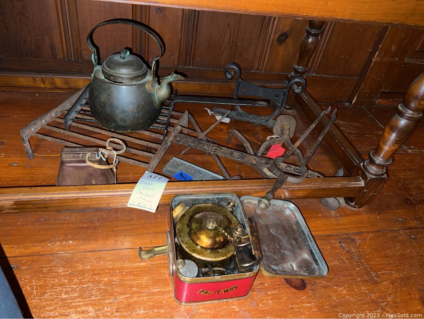 Sold at Auction: Cast iron stove with cast iron coffee pot