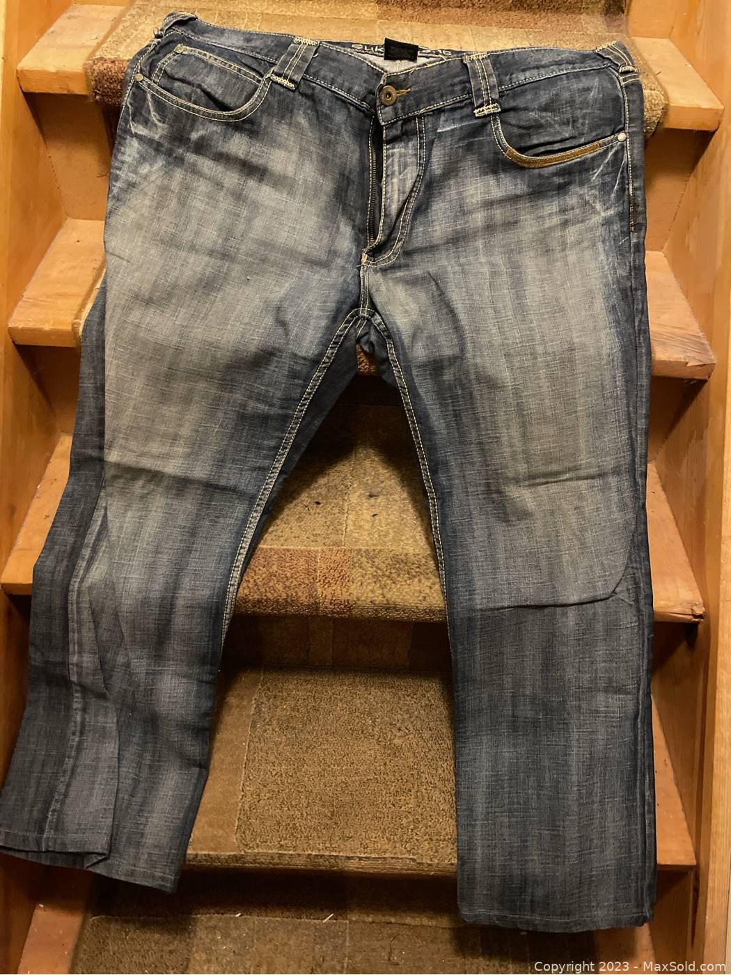 A pair of SUKO jeans in a size 10