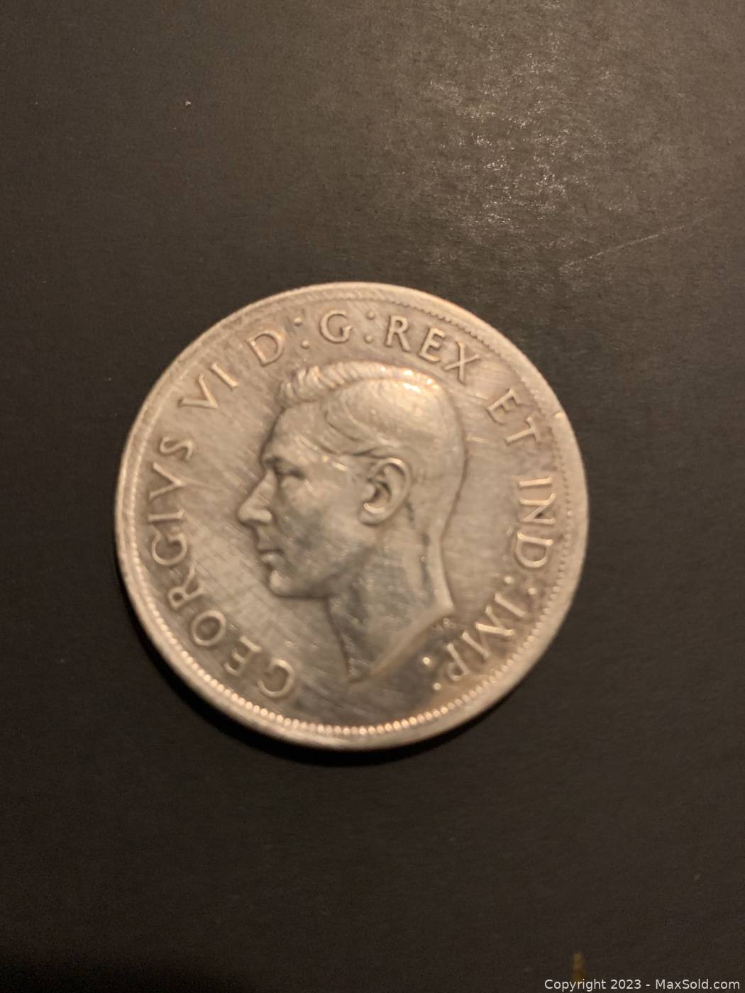 At Auction: 1939 Canada 1 Dollar Coin