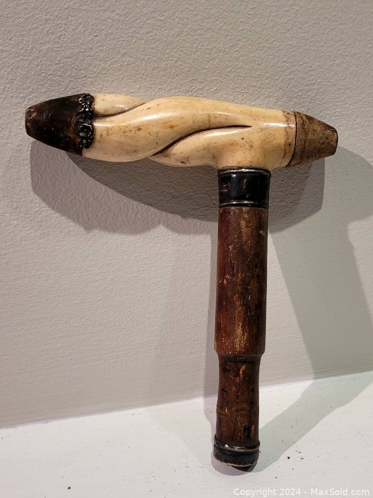 Sold at Auction: Walking stick with a knob in silver