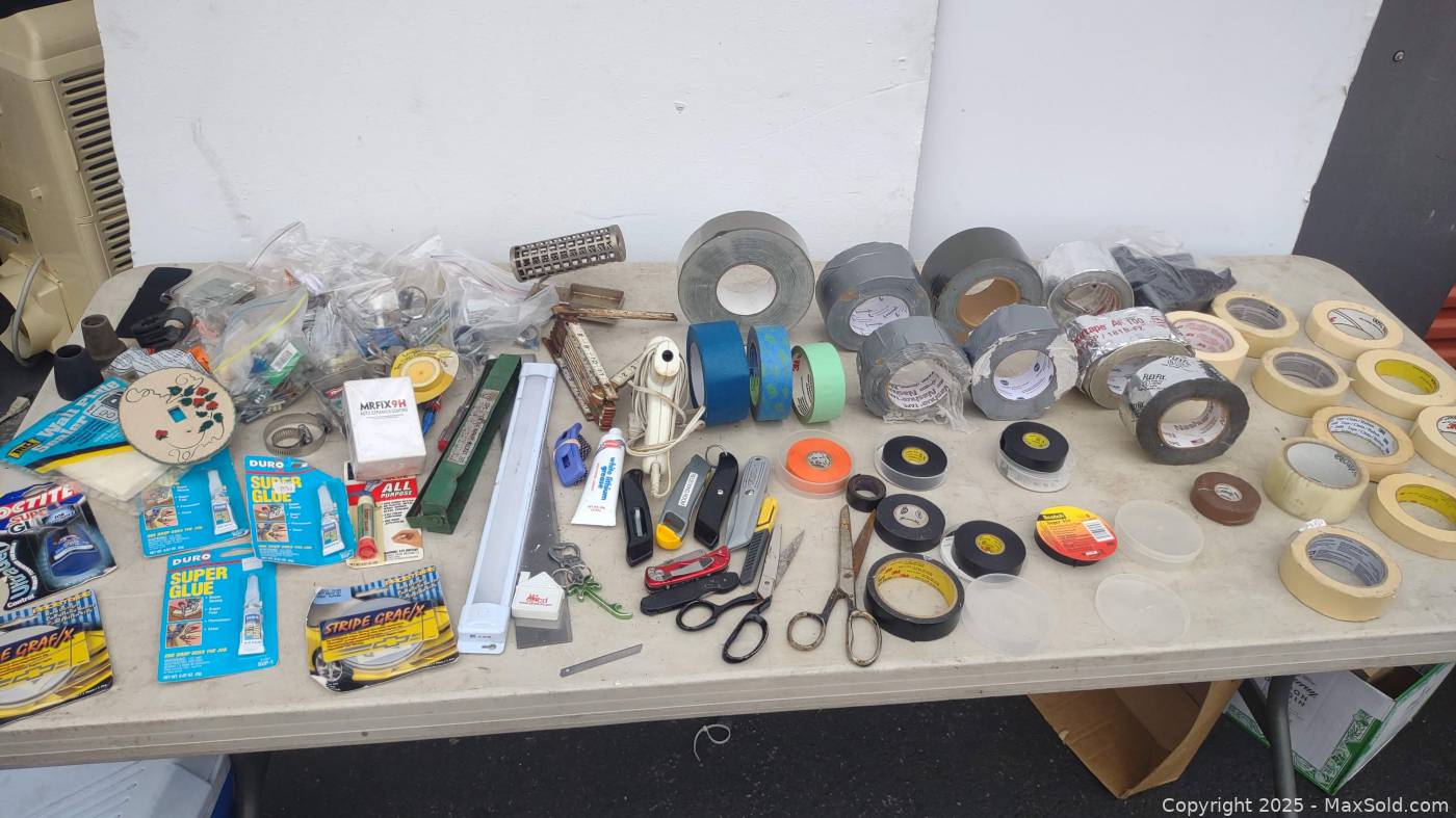 Table Lot Assortment of tape/glue cutters glue tool screws etc