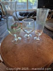 MaxSold Auction: Pat O&#39;Brien&#39;s New Orleans Hurricane Cocktail Glasses, Set of 3 - Coppell (Texas, USA) SELLER MANAGED Downsizing Online Auction - Parker Drive