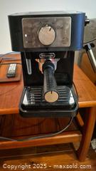 MaxSold Auction:  Espresso / capuccino Machine by Delonghi with Accessories - Kingston (Ontario, Canada) SELLER MANAGED Downsizing Online Auction - Canniff Place