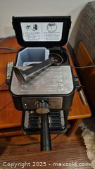 MaxSold Auction:  Espresso / capuccino Machine by Delonghi with Accessories - Kingston (Ontario, Canada) SELLER MANAGED Downsizing Online Auction - Canniff Place