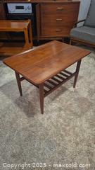 MaxSold Auction: Mid-Century Modern Rectangular Teak-Tone Coffee Table, 30x20x20 - Kingston (Ontario, Canada) SELLER MANAGED Downsizing Online Auction - Canniff Place
