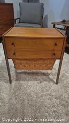 MaxSold Auction: Mid-Century Modern Teak Veneer  Sewing Table with Basket - Kingston (Ontario, Canada) SELLER MANAGED Downsizing Online Auction - Canniff Place
