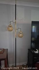 MaxSold Auction: Mid-Century Modern tension pole Two-Light Floor Lamp with Amber Globe Shades - Kingston (Ontario, Canada) SELLER MANAGED Downsizing Online Auction - Canniff Place