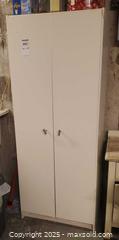 MaxSold Auction: White Laminate Freestanding Storage Cabinet / Utility Pantry C - Ottawa (Ontario, Canada) PARTNER MANAGED Downsizing Online Auction - Garfield Avenue
